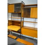 A Staples Ladderax modular wall unit, designed by Robert Heal, comprising : two cupboards,