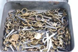 A collection of approximately sixty, various pocket watch keys