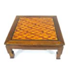 A square Chinese style Coffee table with parquetry top within an ebonised border,