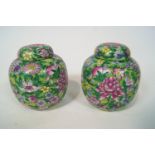 A pair of modern Chinese style green ground ginger jars and covers, a bowl and a plate,