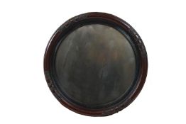 A 'Tondo' form frame mirror, decorated at the Cardinal points,