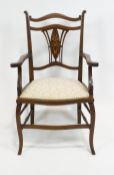 An Edwardian mahogany small salon armchair,