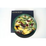 A Moorcroft pottery plate decorated with the golden Oride pattern, factory marks,