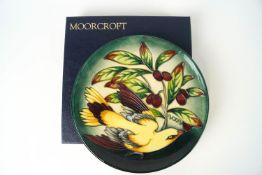 A Moorcroft pottery plate decorated with the golden Oride pattern, factory marks,