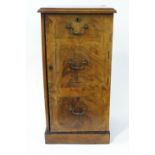 A George III mahogany cross banded side cupboard with three faux drawers