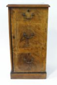 A George III mahogany cross banded side cupboard with three faux drawers
