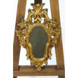 A carved giltwood rococo style mirror framed,