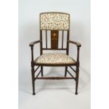 An Art Nouveau elbow chair, inlaid with mother of pearl, 89cm high,