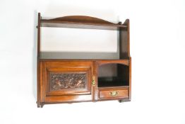 A Victorian mahogany hanging hall cupboard, with front carved cupboard door,