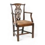 A George III mahogany elbow chair with pierced interlaced splats,