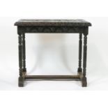 A Victorian carved oak table with deep carved frieze on turned legs, linked by H stretchers,