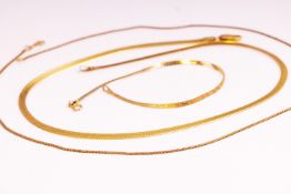 Two yellow gold flat link collar necklaces together with one matching bracelet.