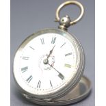 An 800 silver cased open face pocket watch. White ceramic dial with central floral design.