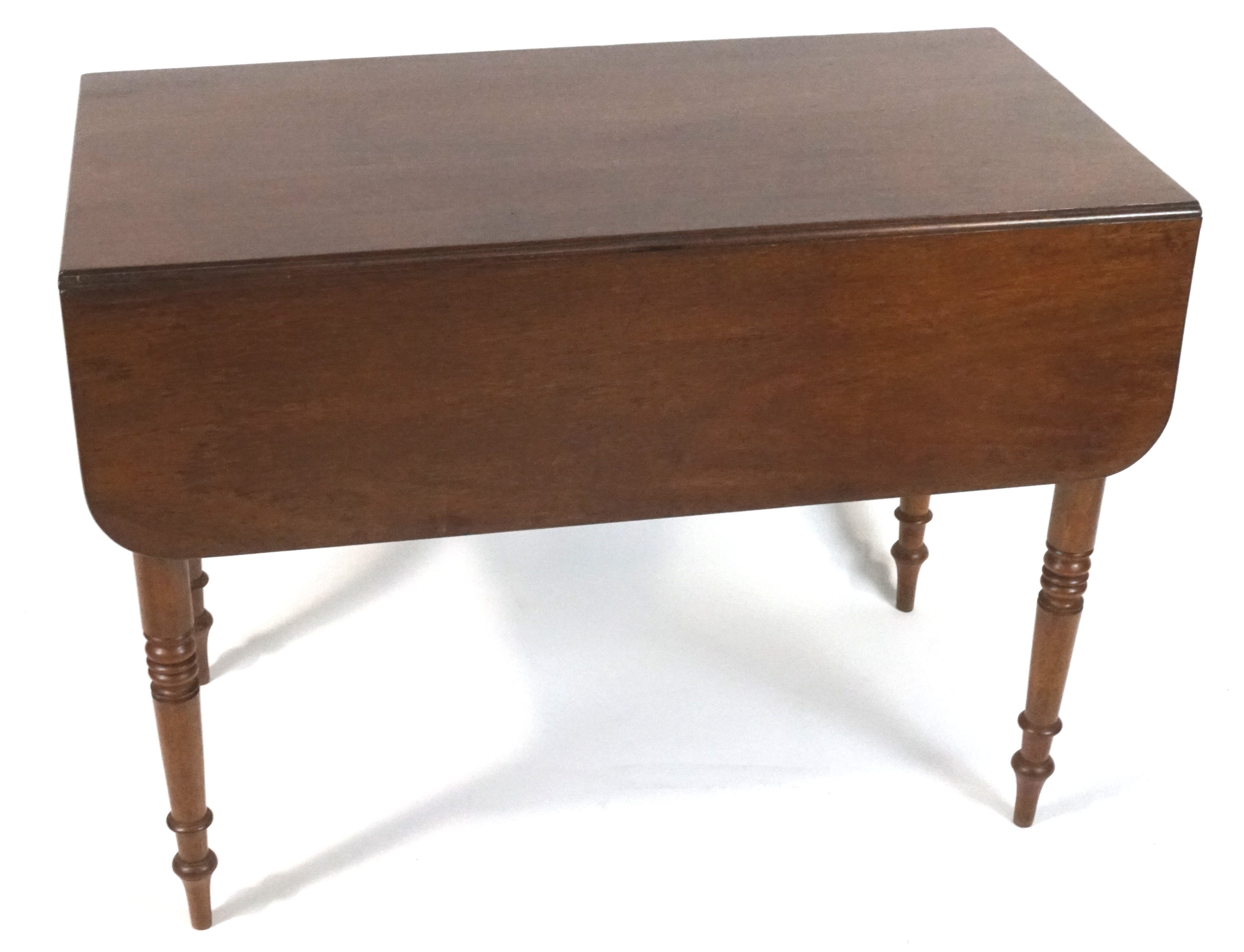 A Victorian mahogany Pembroke table with one frieze drawer on turned tapering legs,
