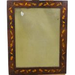 A rectangular wall mirror with Dutch style frame inlaid with scrolling flowering branches,