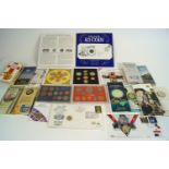 A collection of Commemorative coins sets and medals, including a 1953 coronation coin,