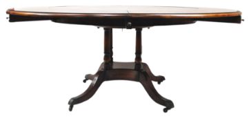 A 20th century mahogany Jupe style dining table,