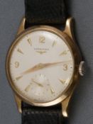 A 9ct gold cased Longines wristwatch. Analogue dial with baton markings and second hand dial.