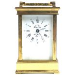 A French (Sainte Suzanne) brass eight day clock, with bevelled glass panelled top and sides,