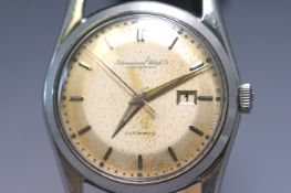 A stainless steel IWC automatic wristwatch. Champagne dial with baton markings and date feature.