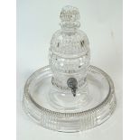 A cut glass ribbed and panel decorated liqueur decanter in the form of a barrel,