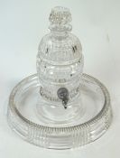 A cut glass ribbed and panel decorated liqueur decanter in the form of a barrel,