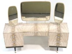 A Retro dressing table, of rounded tripartite form, finished in melamine,