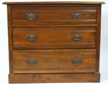 A late Victorian mahogany chest of three drawers with Art Nouveau style handles, on plinth base,