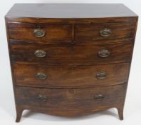 A 19th century mahogany bow front chest of two short and three long drawers on splayed bracket feet