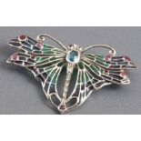 A silver brooch set with topaz, rubies, coloured enamel and marcasite