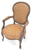 A Victorian mahogany show frame armchair with cartouche shaped back on cabriole legs