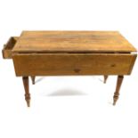 A pine Pembroke table with two frieze drawers on turned tapering legs,