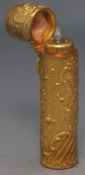 A 19th century gilt metal scent bottle, the cylindrical case moulded with rococo 'c' scrolls,