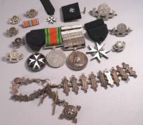 A medal group with the Defence medal, The Service medal of the Order of St John with six bars,