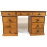 A pine pedestal desk with plain galleried top above three frieze drawers,