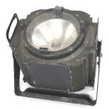 A large vintage theatre stage light, with mounting bracket and filter clips,