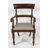 A Victorian mahogany elbow chair with rail back, drop in seat and turned tapering legs,