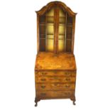 A walnut and mahogany 18th century style bureau bookcase,