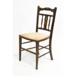 An Edwardian mahogany salon chair,