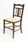 An Edwardian mahogany salon chair,