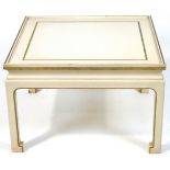 A square white painted coffee table with inset glass top on Chinese style legs.