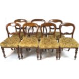 A set of seven Victorian mahogany balloon back chairs