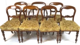 A set of seven Victorian mahogany balloon back chairs