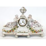 A 19th century German porcelain clock, with the Meissen mark, set a globe over the dial,