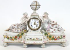 A 19th century German porcelain clock, with the Meissen mark, set a globe over the dial,