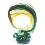 A Mdina glass abstract flat backed sculpture, with turquoise, brown and green inclusion hints,