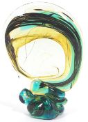 A Mdina glass abstract flat backed sculpture, with turquoise, brown and green inclusion hints,