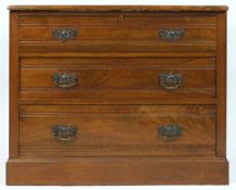 A late Victorian mahogany chest of three long drawers, on plinth base with later pine top,