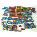 A mixed collection of boxed Matchbox cars, buses and vans,