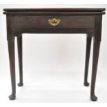 An early George III mahogany tea table with one frieze drawer, on tapering legs with pad feet,